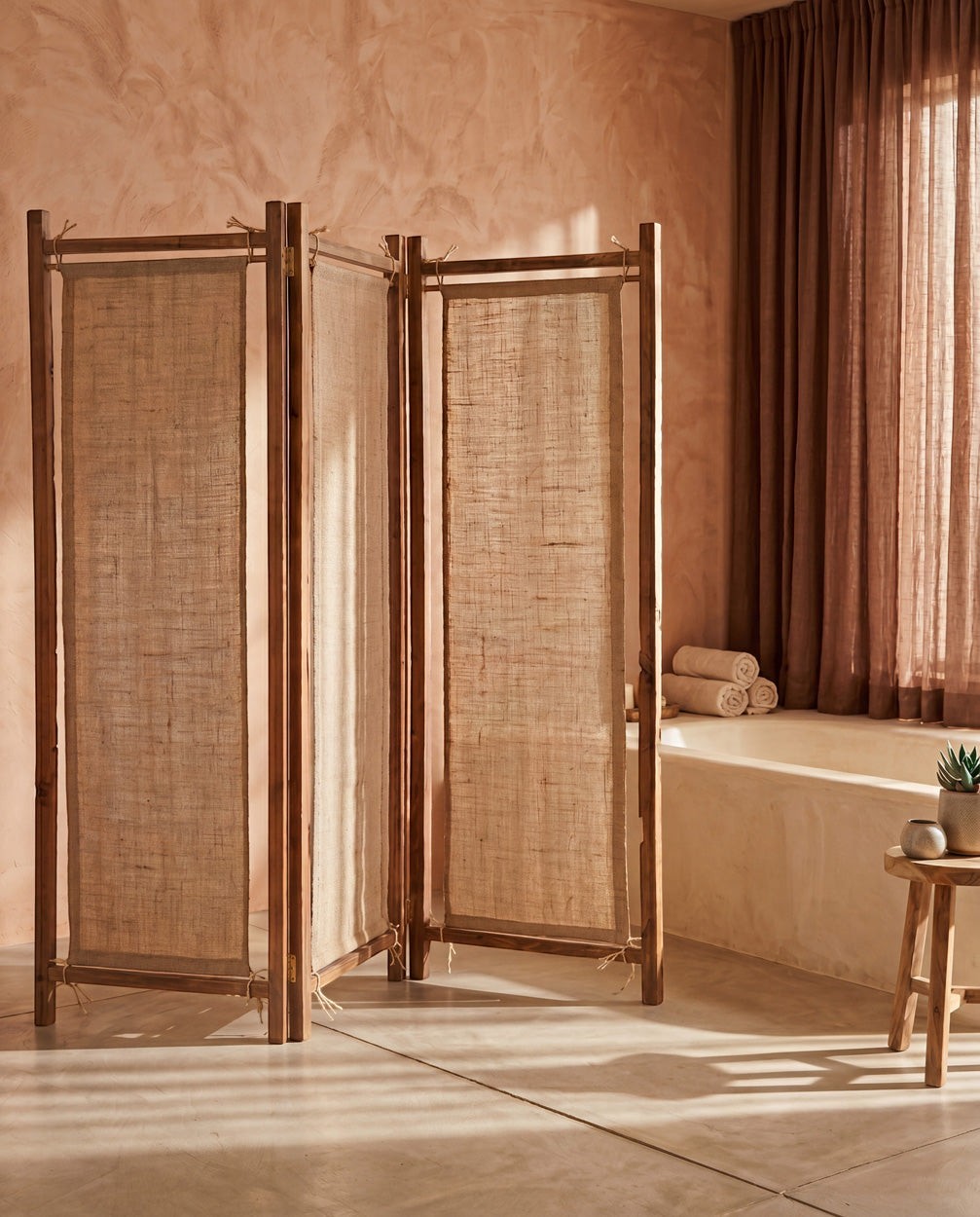 Kayu Living Zenbu room divider made of reclaimed teak wood and natural jute fabric in a rustic bathroom setting.